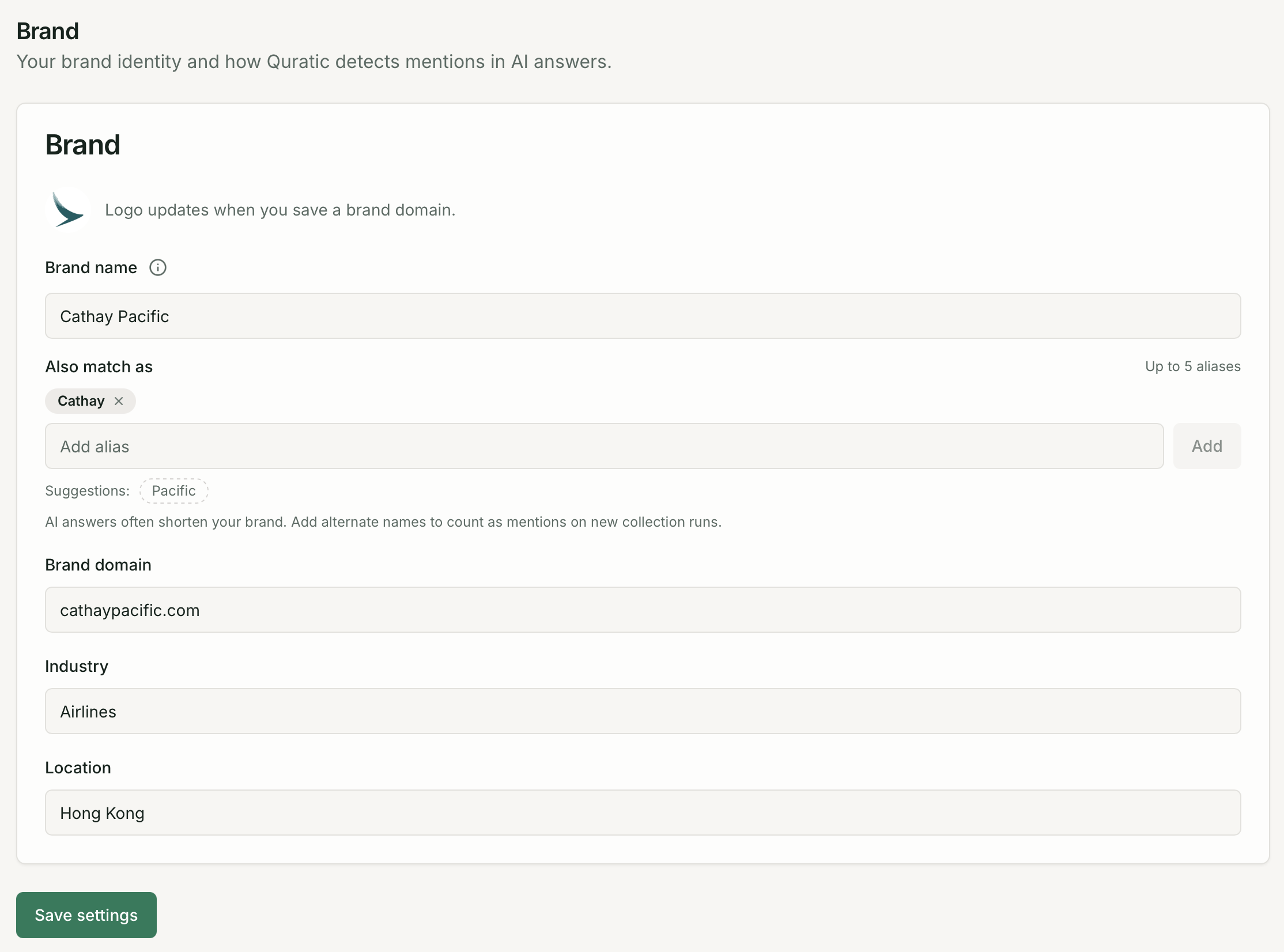 Project settings page showing brand details, AI model toggles, and alert threshold section
